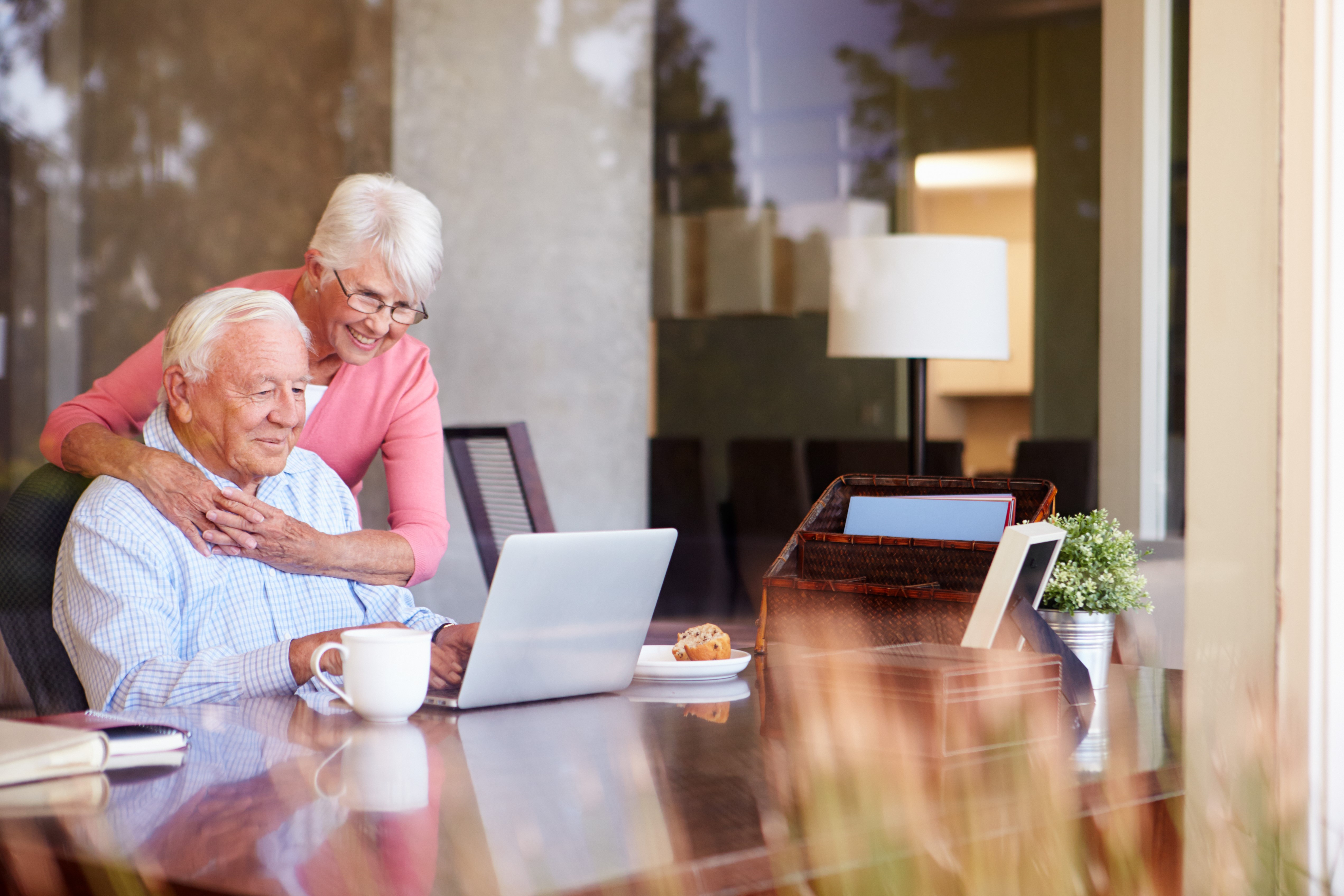 Happy couple looking at computer