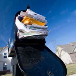 Overflowing mailbox of credit card offers