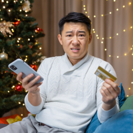 Young man disturbed by holiday shopping scam