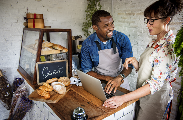 bakery owners talking over counter